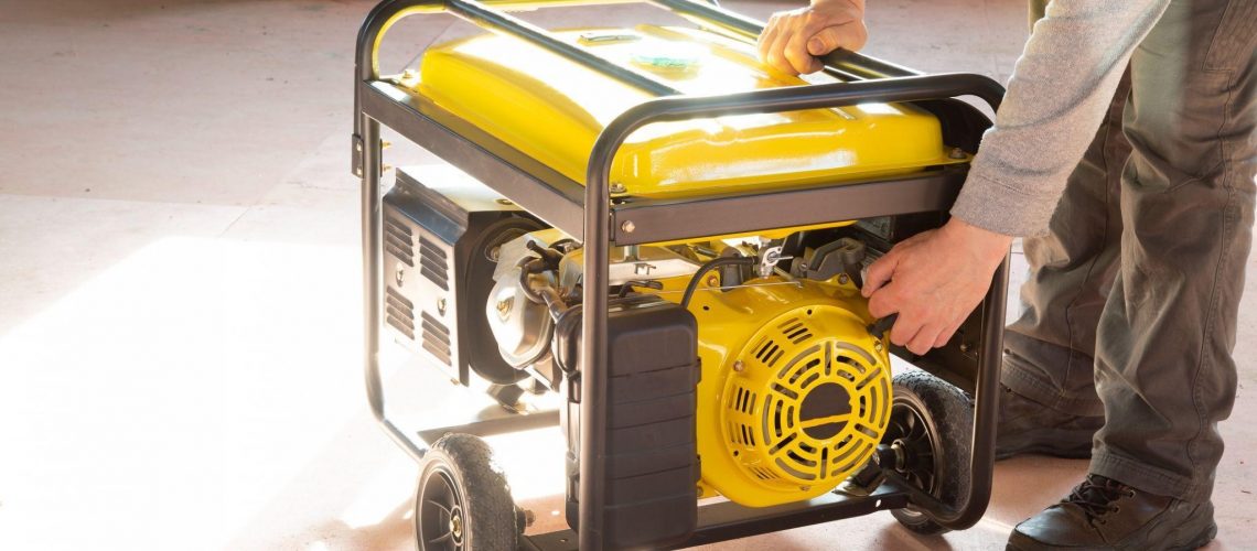 worker holding a generator